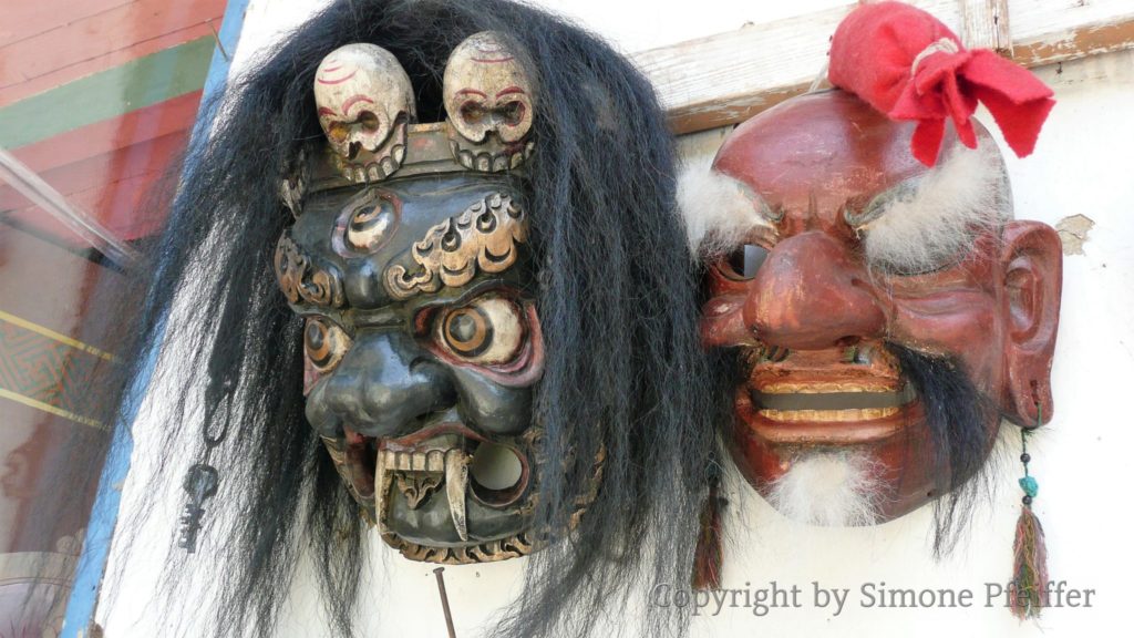 Masks represent deities that occur in sacred dances.