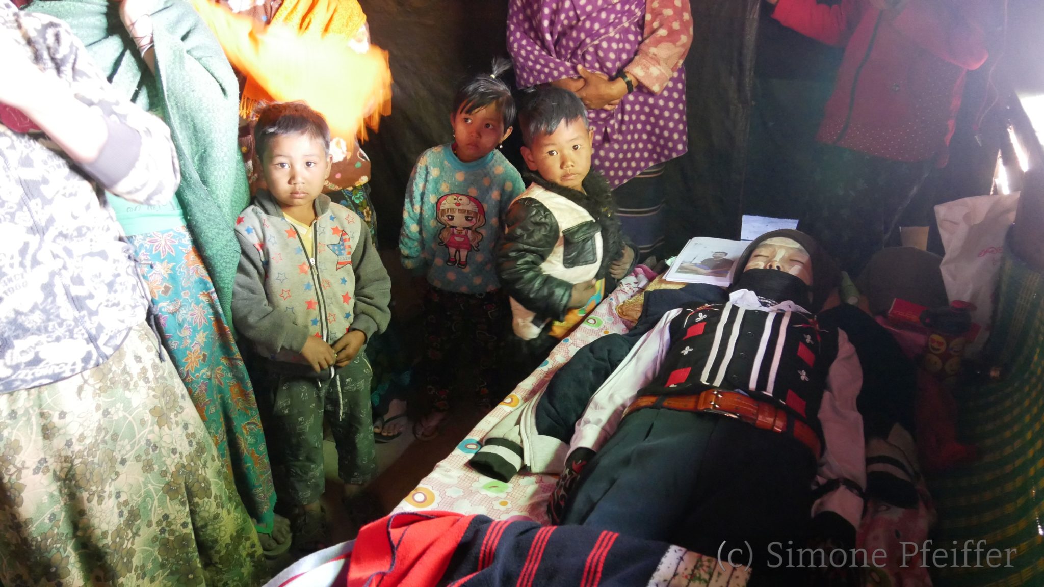 Lay Yom from Kya Lay was laid out in his school uniform. His parents were proud of the good student.